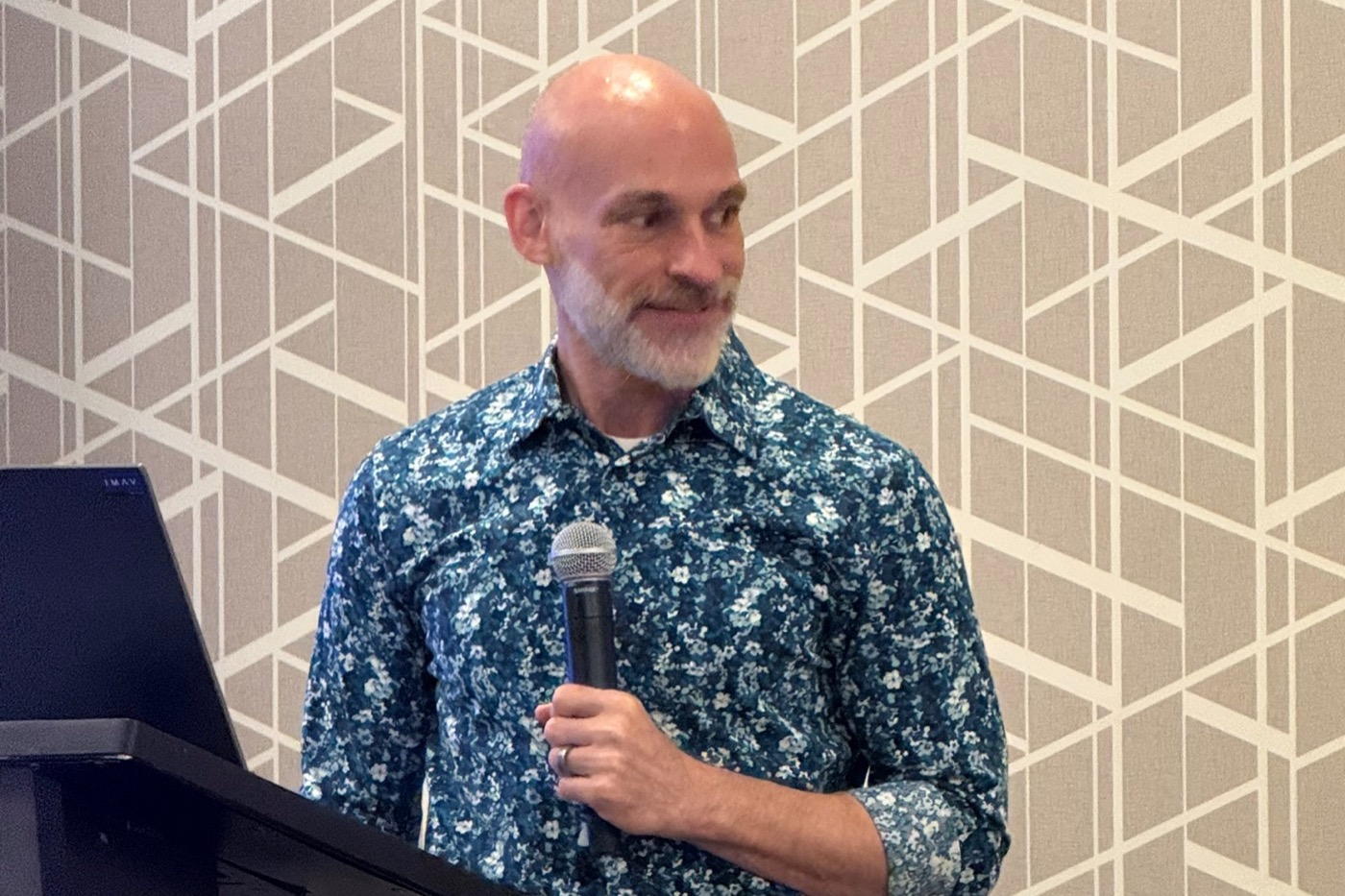 Richard Greene speaking to a group